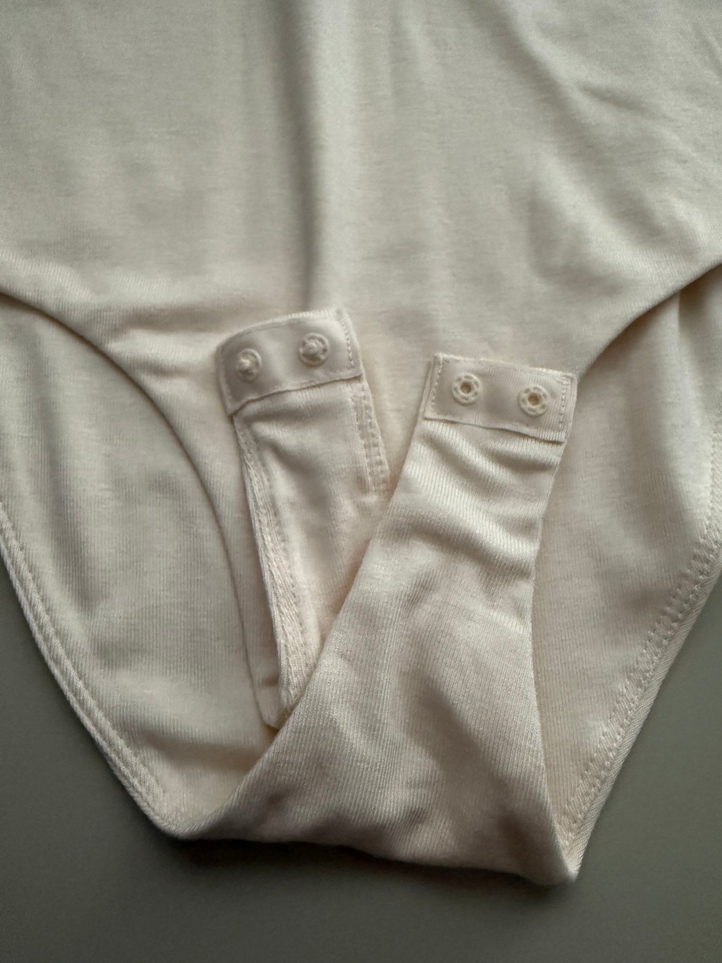 TWIST FRONT BODYSUIT